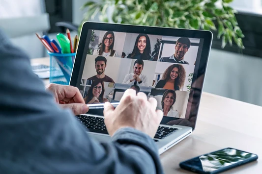 Remote worker using a refurbished smartphone during a video call